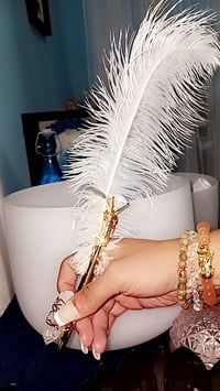 Manifestation pen with wrapped crystal