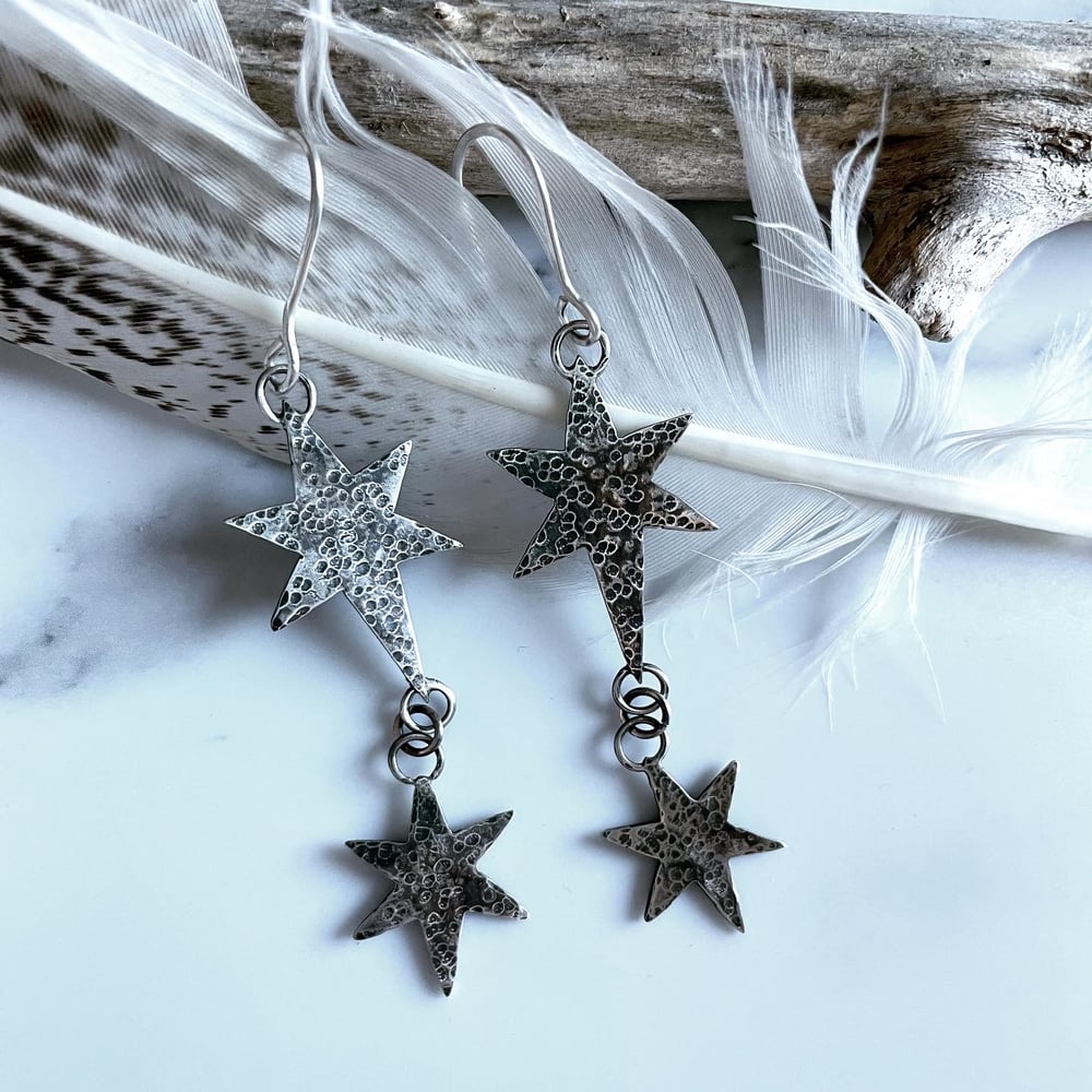 Handmade silver cosmic star dangly earrings. Celestial silver starry earrings.