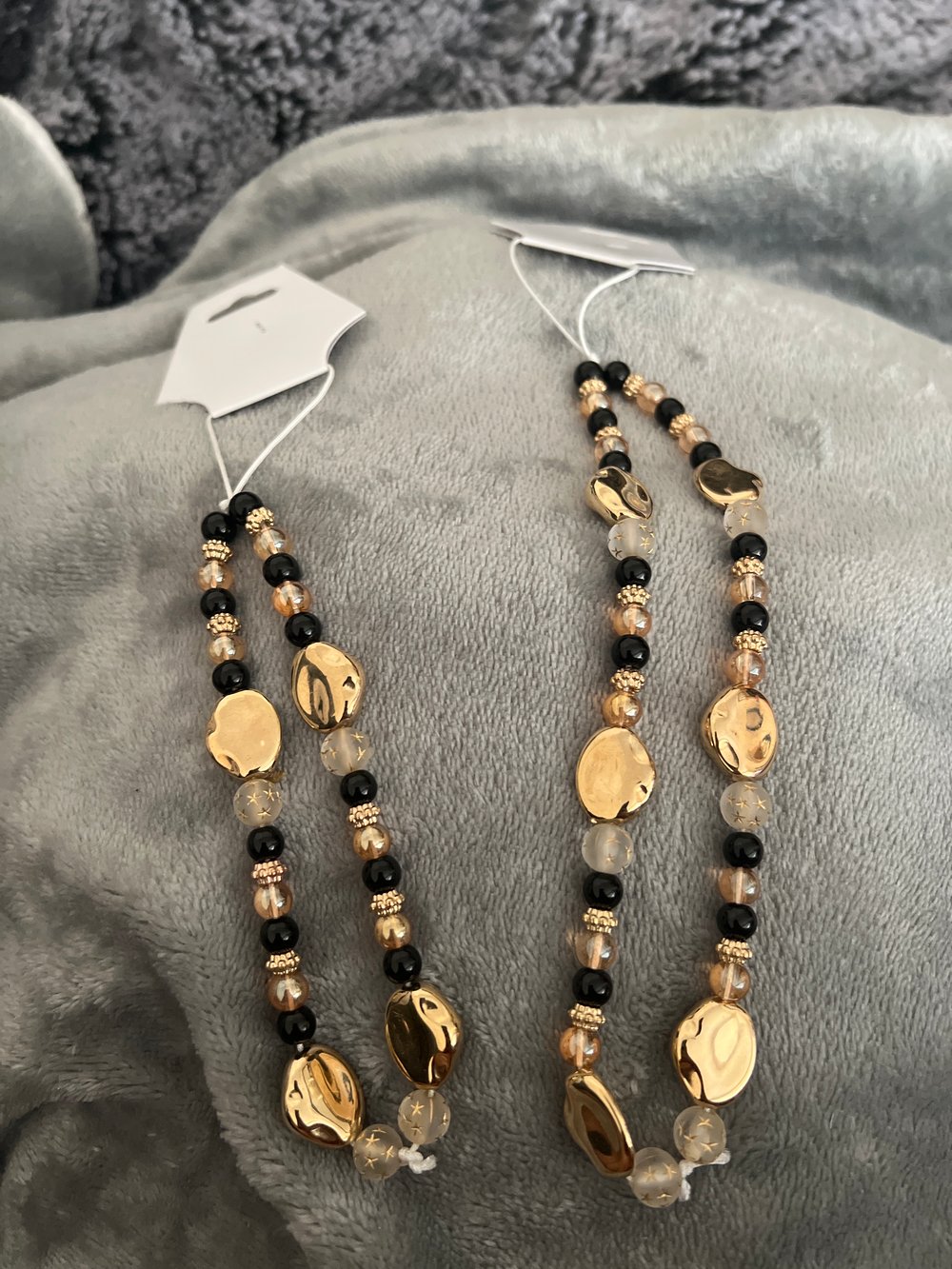 Image of gold theme phone charm 