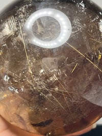Image 22 of Golden Rutile In Smoky Quartz Sphere #1770