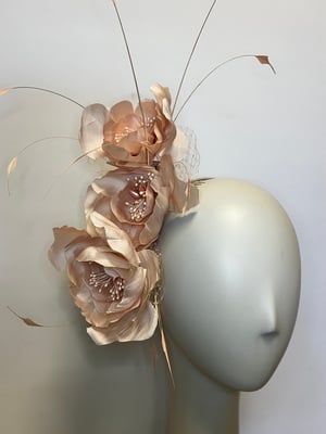 Image of Pale pink silk flower headpiece.