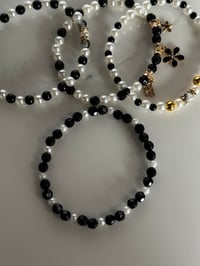Image 5 of Wild Blooms Black, Gold, and Cream Tumbler Bracelet Stack