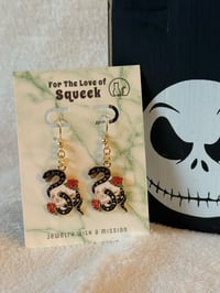 Image of Snake and Skulls
