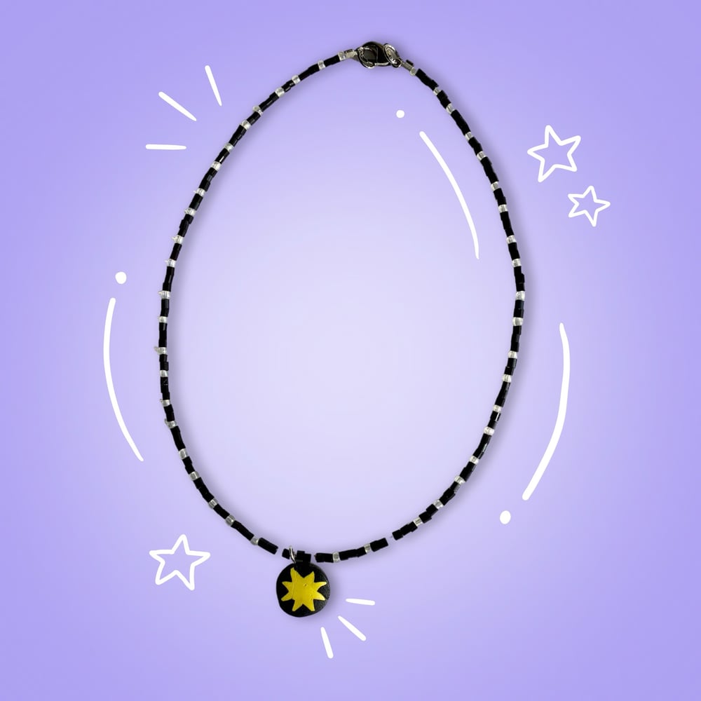 Image of black and white star charm necklace