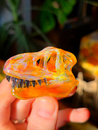 Image 1 of Opalized amber purple T-Rex skull pendant.