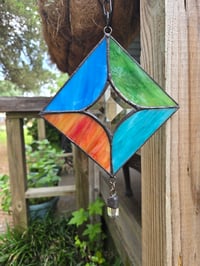 Image 1 of Stained glass suncatcher with large quartz crystal
