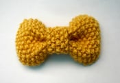 Image of stitch bow hair clip in mustard