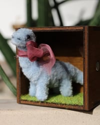 Image 1 of Pipe cleaner brontosaurus with wooden modular display