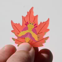 Image 5 of Rosy Maple Moth Frosted Acrylic Pin