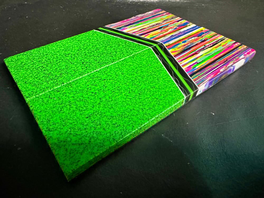 Image of @Kaoticartworks Resin & Green Grip-Tec GLOW Segmented Knife Scales