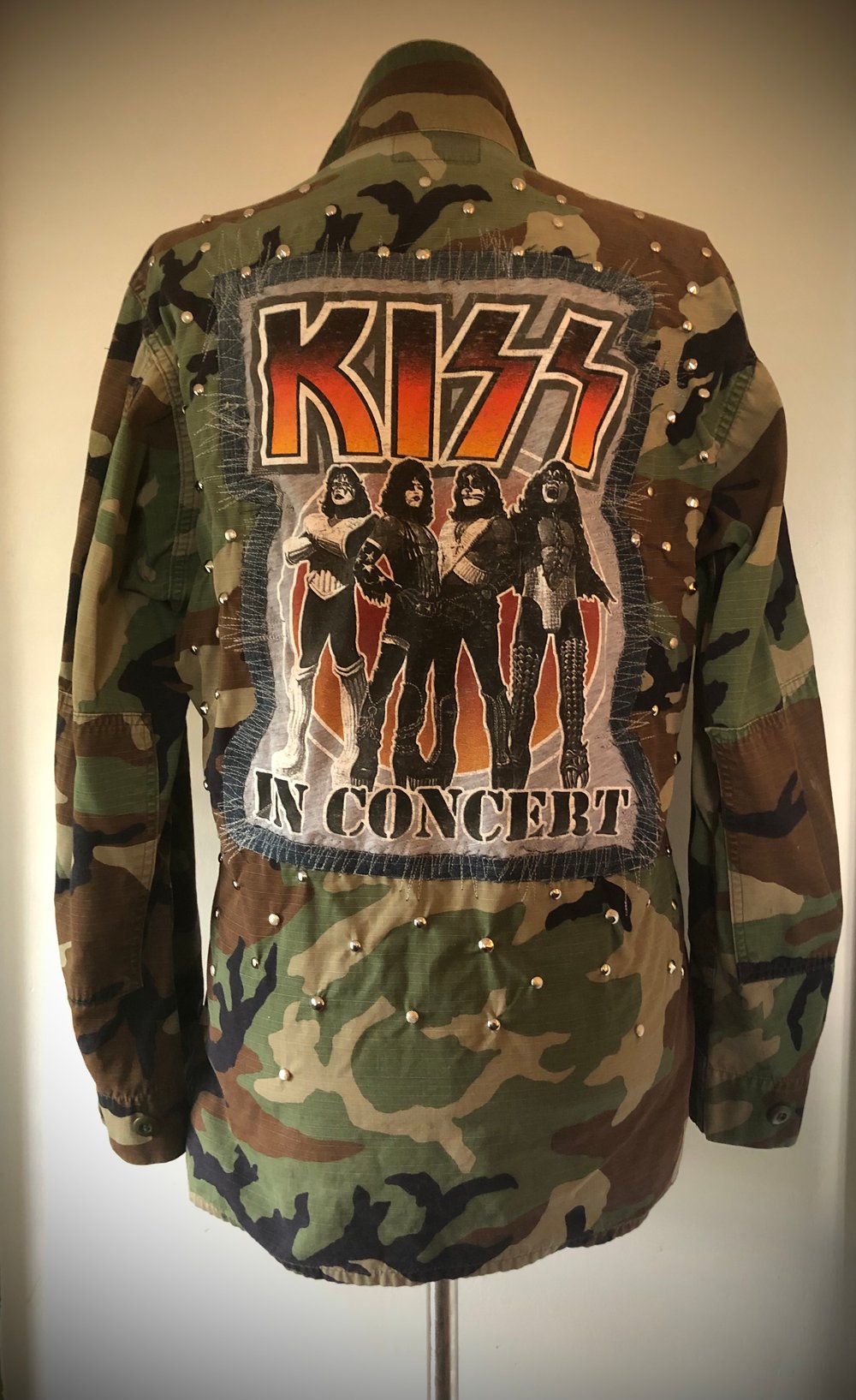 Upcycled “KISS” studded vintage army jacket 