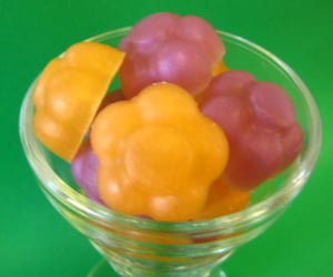 Image of Apricot Freesia flower favors or guest soaps in a jar