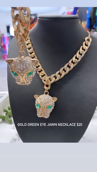 Gold green eye jawn necklace 