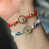 Virgencita with evil eye bracelet