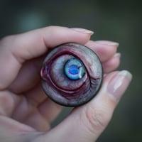 Image 4 of Custom Swappable Phone Grip for smartphones, bright blue reflective pupil, glow in the dark 