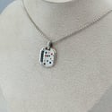 Enamel and sapphire tag 