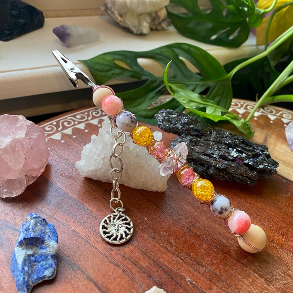 Image of strawberry sunset roach clip 