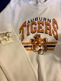Image 1 of Auburn Tigers size small sweat shirt with earrings