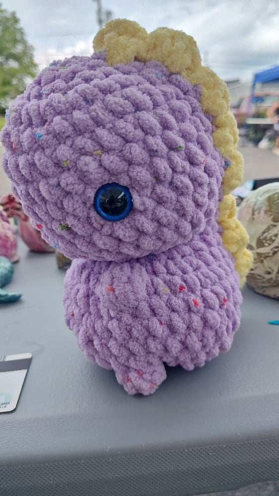 Image of Plush Purple Crochet Dinosaur – Handmade Amigurumi Dino Toy with Yellow Spikes