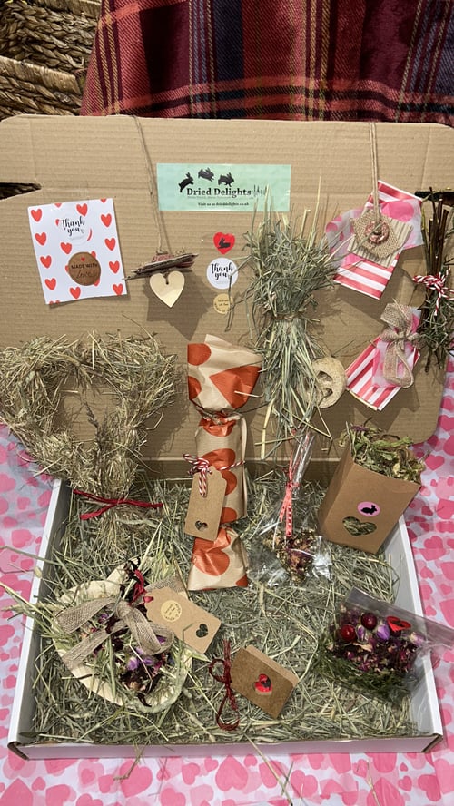 Image of Heart shaped healthy munchy treat bite with rose petals