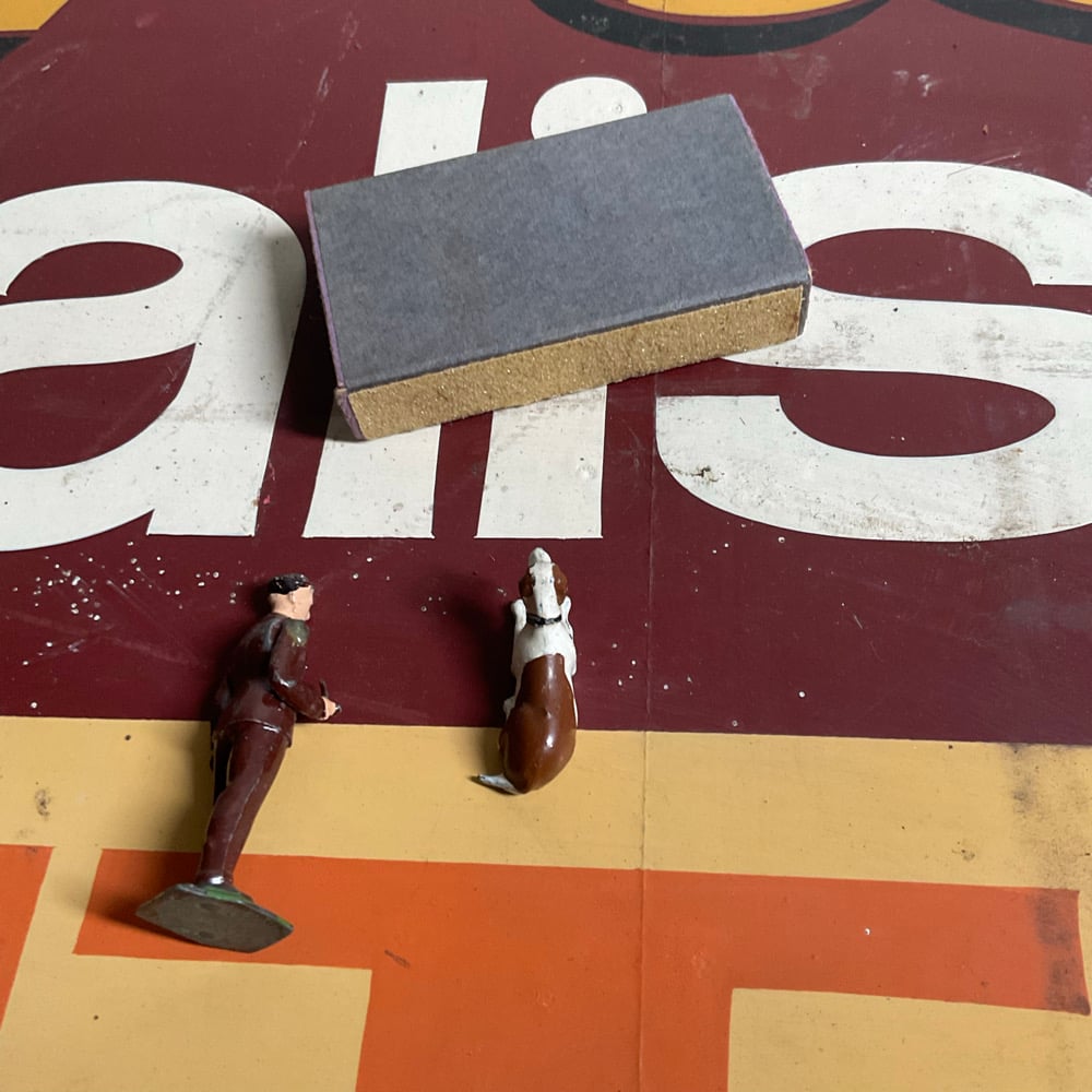 Image of Guy With Pipe,Dog & Matcbox