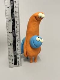 Image 11 of A blue thing peeking out of a brown thing 2