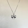 silver bow stainless steel necklace