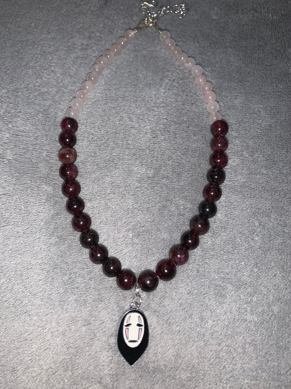 Image of no face necklace 