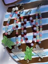Image 2 of glass bead phone charms with trinket 