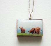 Image of Frolicking Cows Pendant