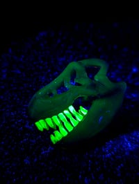 Image 4 of Royal jelly mini T-Rex skull pendant with uv reactive teeth 💜 