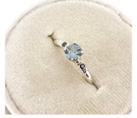 Image 1 of ice blue Australian sapphire and black diamond engagement ring