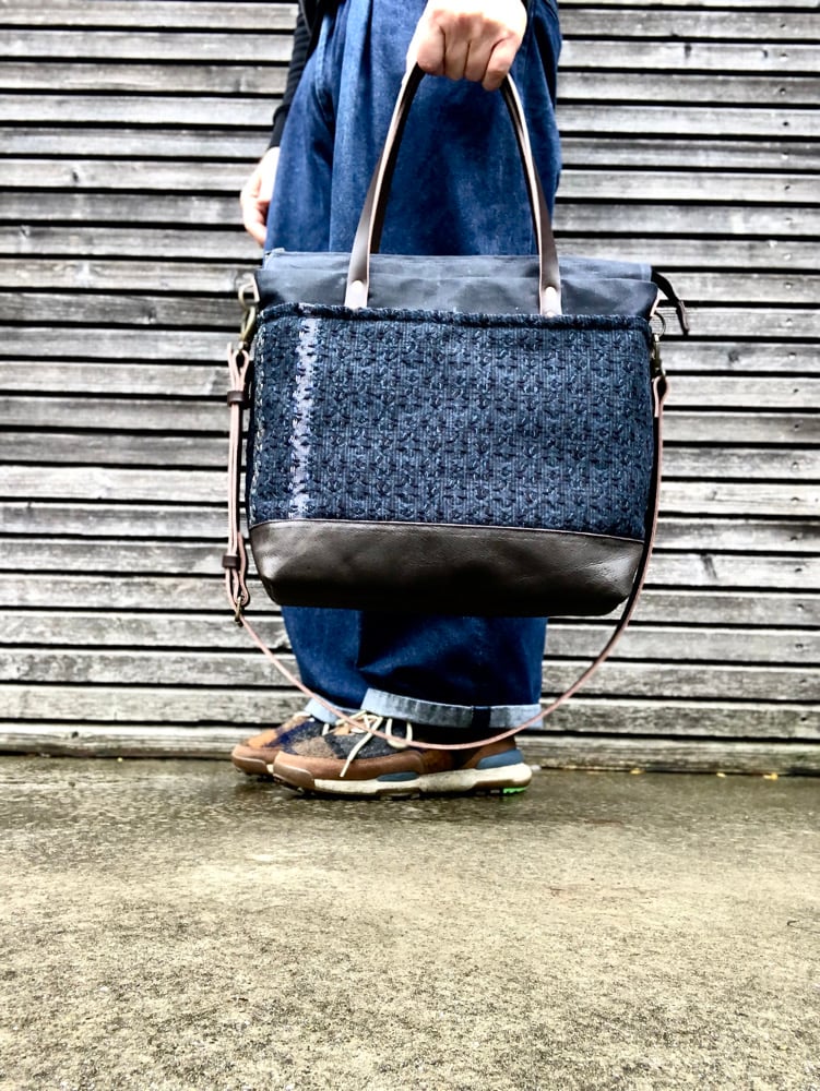 Image of Black Waxed canvas carryall with handwoven exterior pocket 