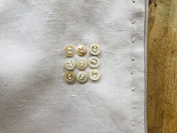 Image of moon pale lilac  bag with ecru buttons