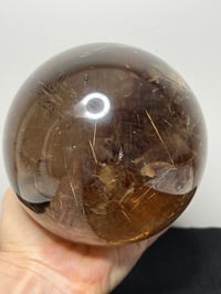 Image 14 of Golden Rutile In Smoky Quartz Sphere #1770