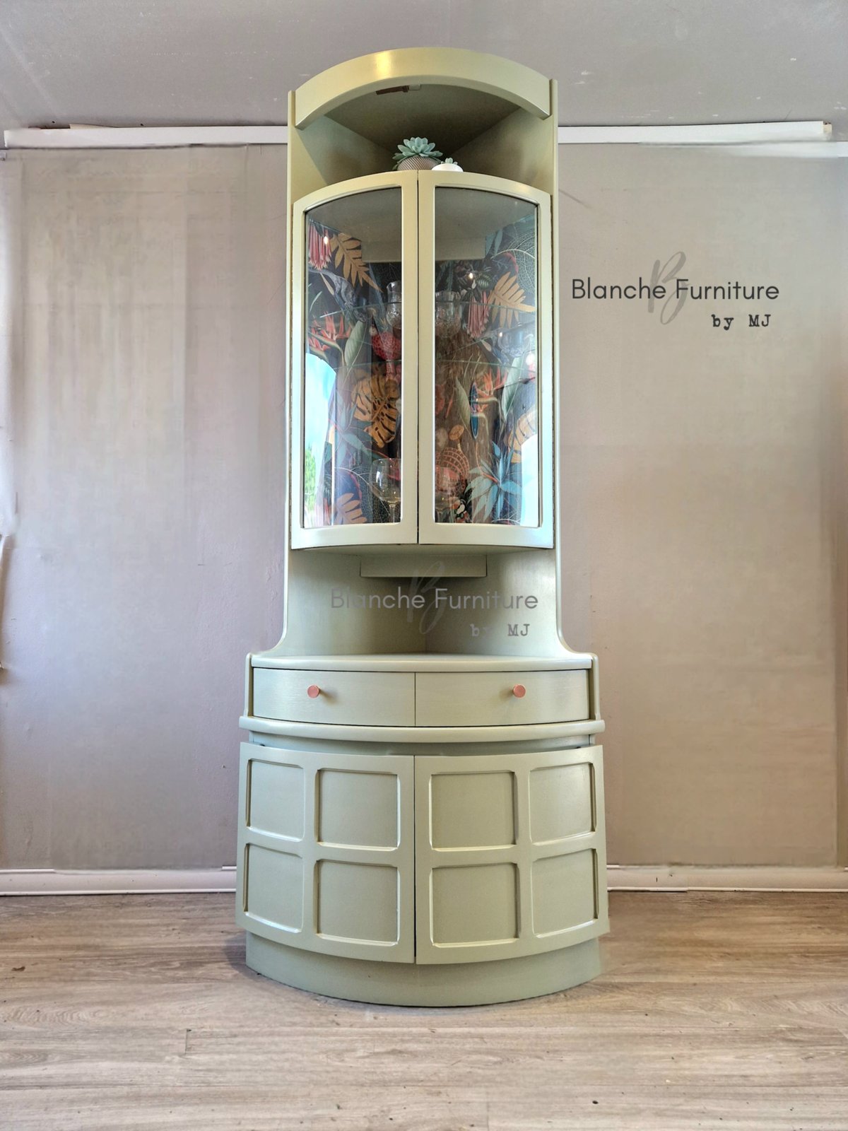 Image of Nathan Corner Drinks Cabinet unit with botanical lining.