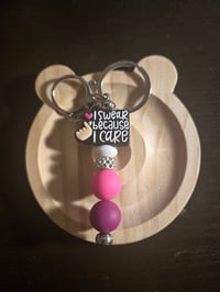 I Swear Because I Care Keychain 