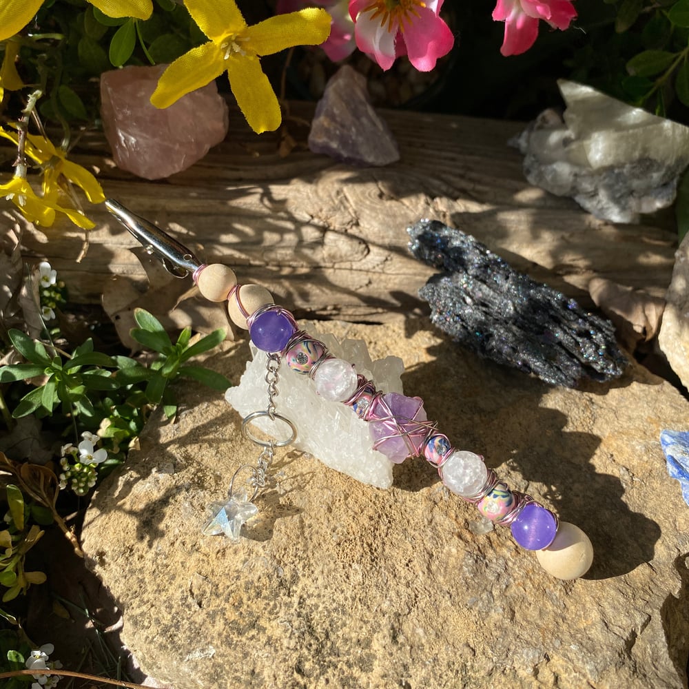 Image of magenta sun roach clip
