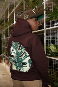 Image 1 of Brown Monstera Leaf Hoodie (Glow In Dark) 