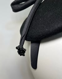 Image 2 of Black felt button w silk rouleau bow 