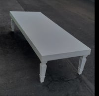 Image 1 of Kid white table that seat 10 with kids chairs,  the legs fold 