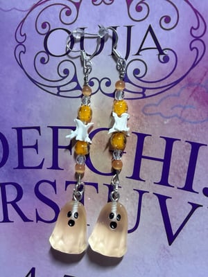 Image of Snake Vertebrae Glow in the Dark Ghost Earrings