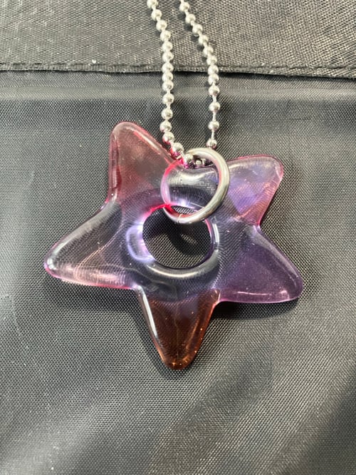 Image of red/pink/purple star