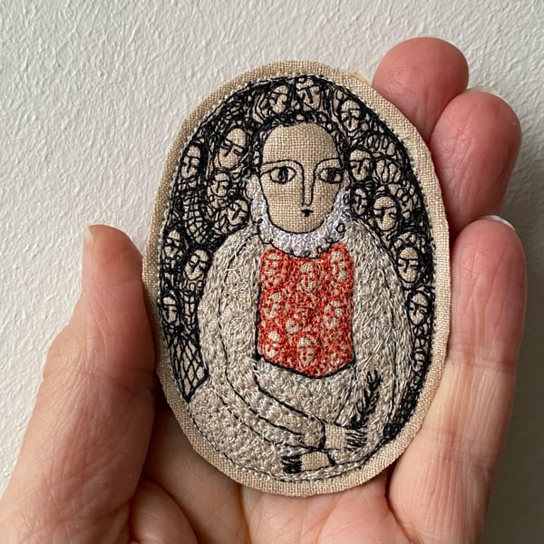 Image of Embroidery portrait brooch - fine woman in silver and pale orange 