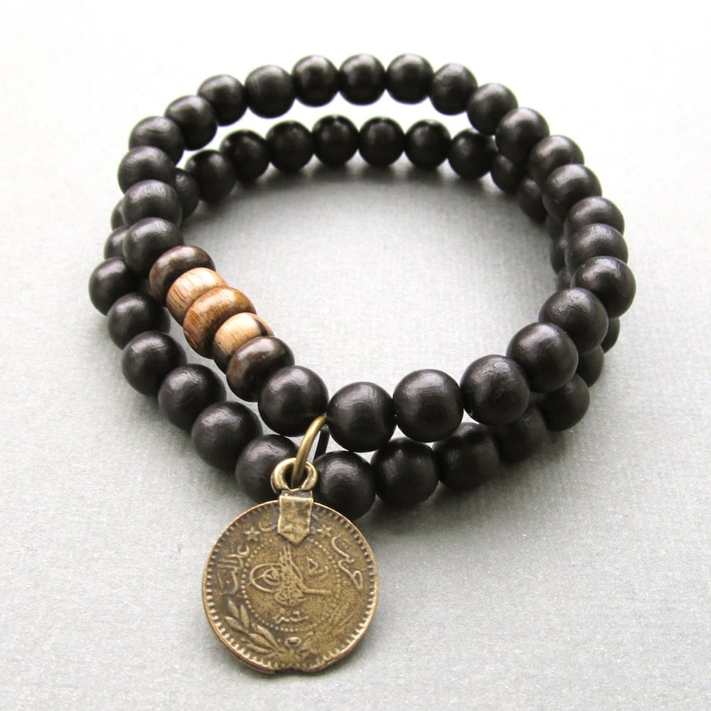 Image of Double black beaded stretch bracelet with coin charm