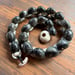 Image of Speckled Kupe'e necklace with puka and cowrie lip clasp 22 inch