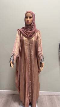 Image 1 of Korean shimmer fabric Flared sleeve abaya rose gold it comes with a matching scarf 