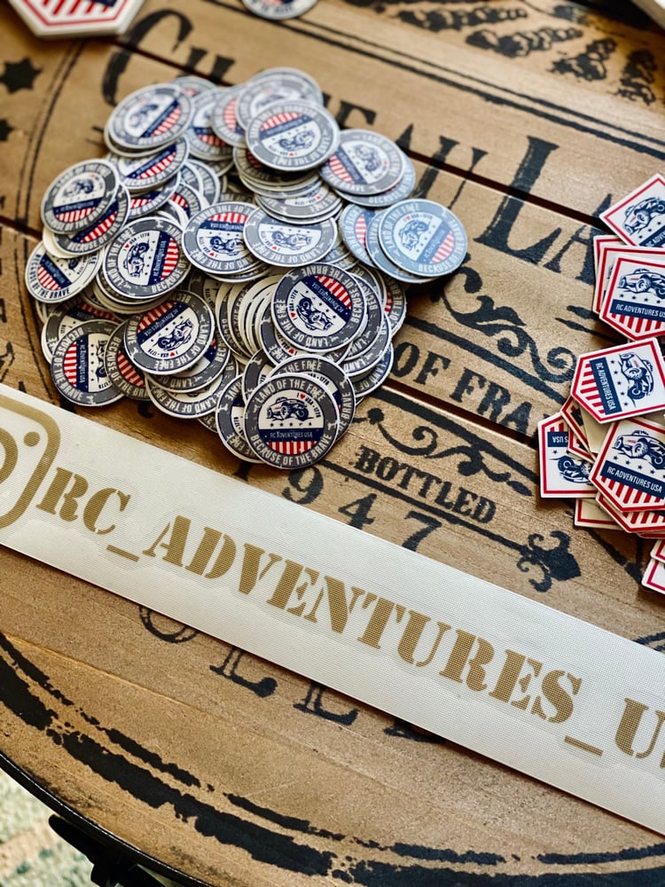 Image of 1” x 1” Round sticker bicolor grey & white  “LAND OF THE FREE BECAUSE OF THE BRAVE”