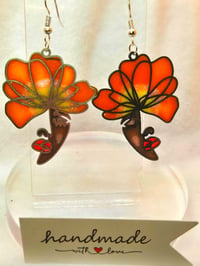 Image 1 of Handcrafted Resin Face with Flower 