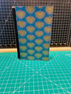 Softcover journal with blue and gold cover